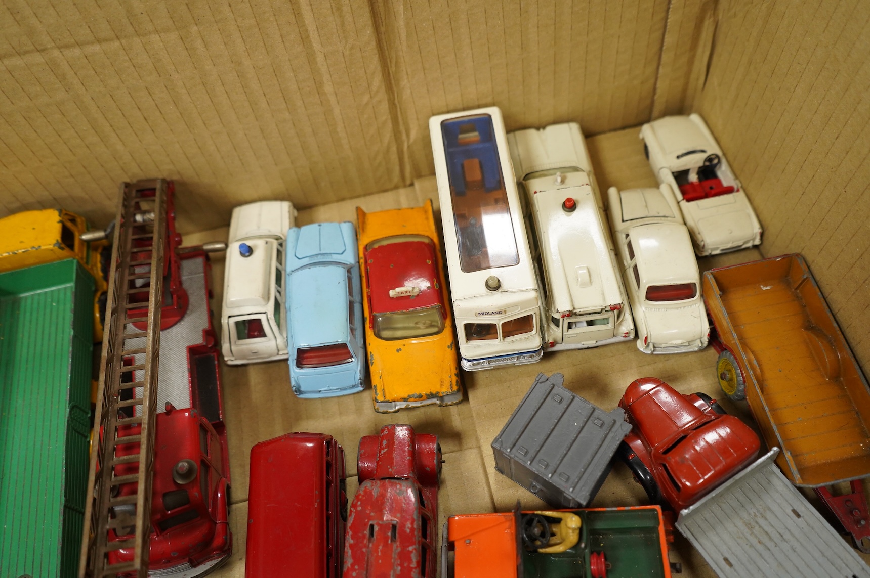 A collection of thirty-five Dinky Toys and five Spot On diecast vehicles, including; a Foden tanker, Leyland octopus, Maudsley horsebox, telephone service van, Royal mail van, and a selection of other cars and commercial